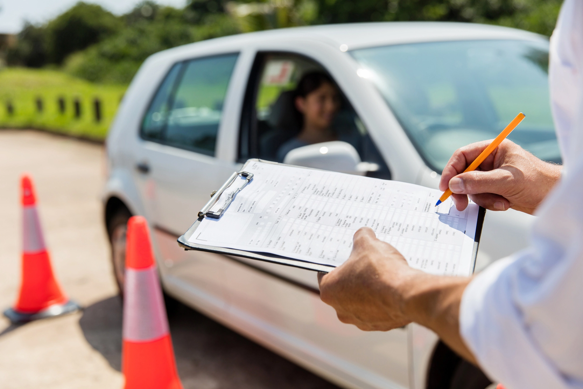 A student learning to drive and a driver instructor